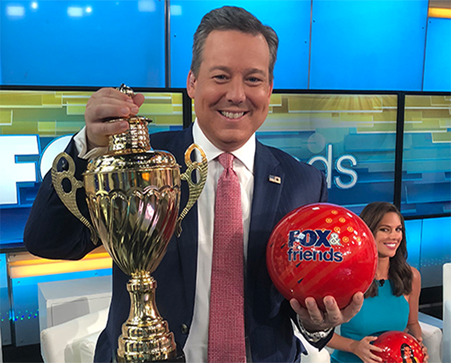 Host with Ball and Trophy